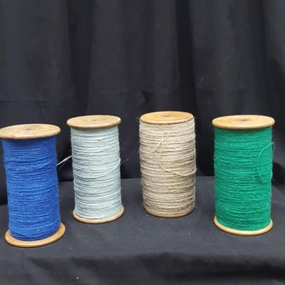 Wooden Bobbins with yarn