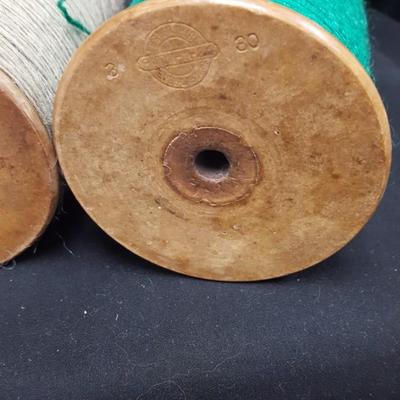 Wooden Bobbins with yarn