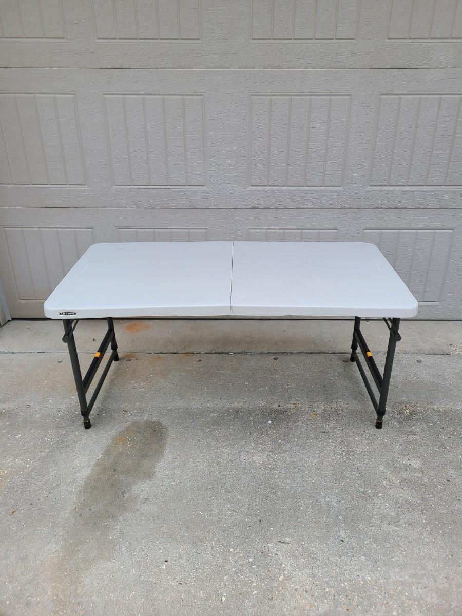 LIFETIME ADJUSTABLE FOLDABLE 4' x 2' Table | EstateSales.org