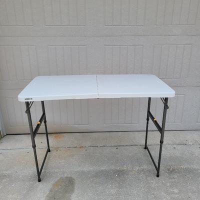 LIFETIME ADJUSTABLE FOLDABLE 4' x 2' Table | EstateSales.org