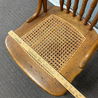 Vintage Spindel Back Cane Seat Dining Chair with Carved Dragon Details on Back Rest