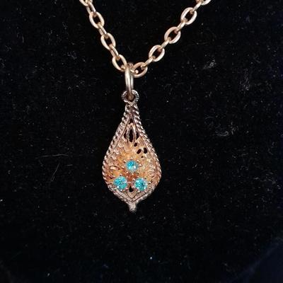 Two gold toned necklaces