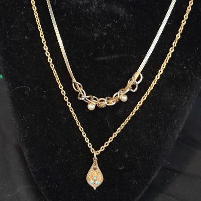 Two gold toned necklaces