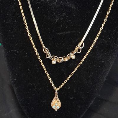 Two gold toned necklaces
