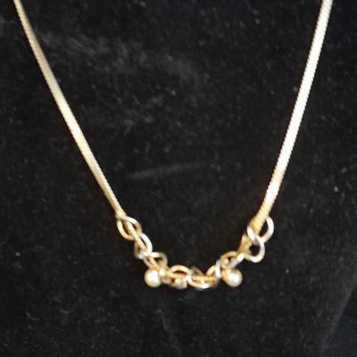 Two gold toned necklaces