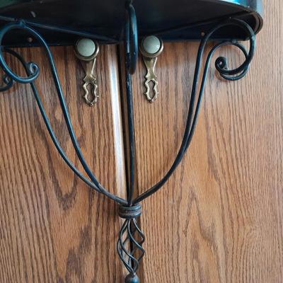 Black metal wall shelf with white Cupid and Psyche Statue