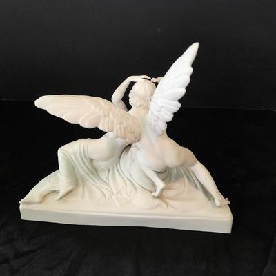 Black metal wall shelf with white Cupid and Psyche Statue