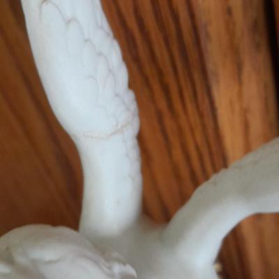 Black metal wall shelf with white Cupid and Psyche Statue