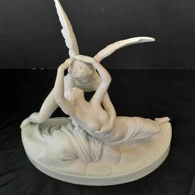 Black metal wall shelf with white Cupid and Psyche Statue