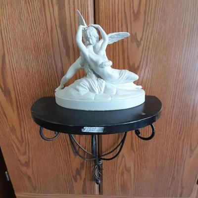 Black metal wall shelf with white Cupid and Psyche Statue