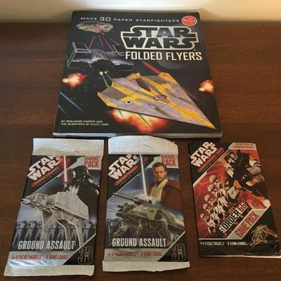 Star Wars collector cards and paper airplane book