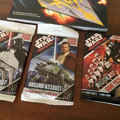 Star Wars collector cards and paper airplane book