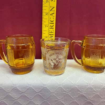 2 yellow mugshot glasses and New Mexico shot glass
