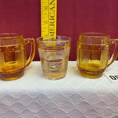 2 yellow mugshot glasses and New Mexico shot glass