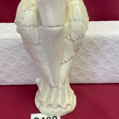 White, porcelain,bisque Angel holding a dove