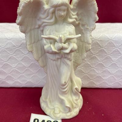 White, porcelain,bisque Angel holding a dove