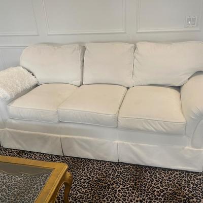 triple seat white sofa