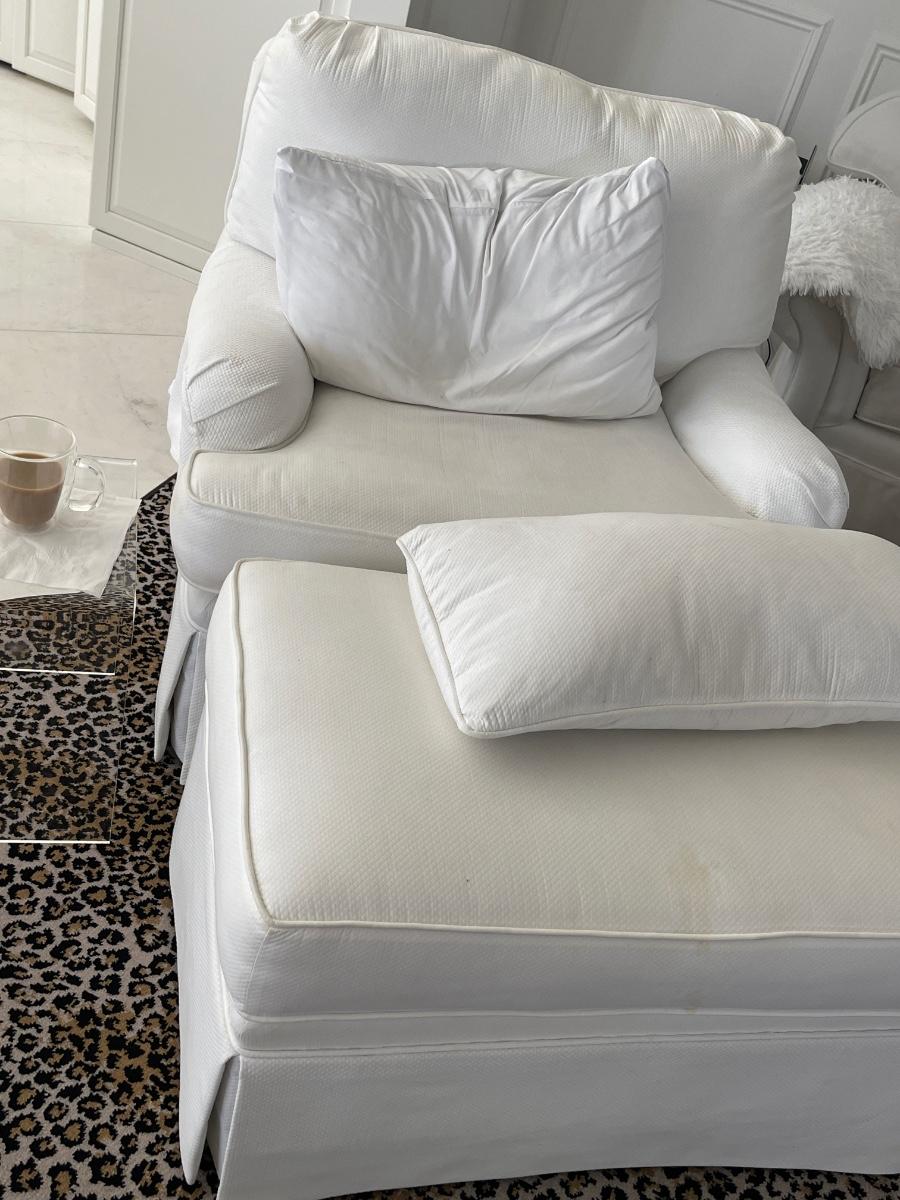 White upholstered chair and ottoman
