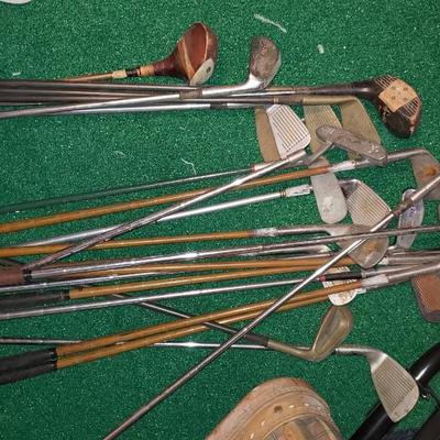 Bag of antique golf bags, some Spalding