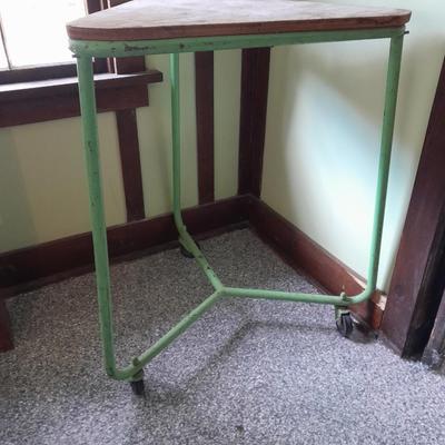 Vintage metal framed triangle shaped table on casters