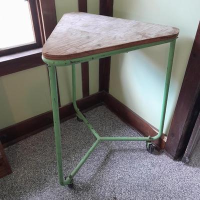 Vintage metal framed triangle shaped table on casters