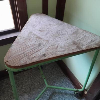 Vintage metal framed triangle shaped table on casters