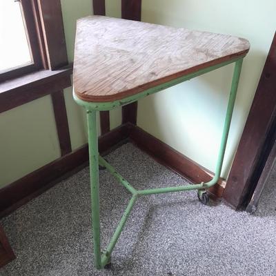 Vintage metal framed triangle shaped table on casters