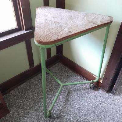 Vintage metal framed triangle shaped table on casters