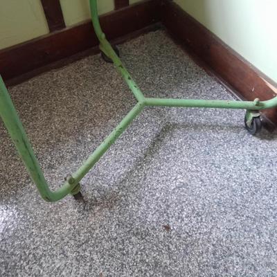 Vintage metal framed triangle shaped table on casters