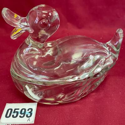 Glass duck on nest