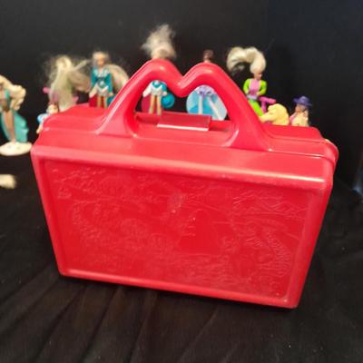 McDonald's Happy Meal toys, Barbie's and Disney characters with a red McDonald's box