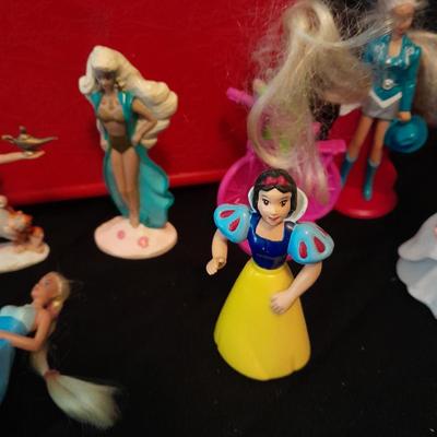 McDonald's Happy Meal toys, Barbie's and Disney characters with a red McDonald's box