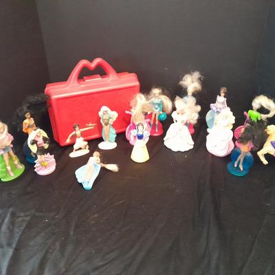 McDonald's Happy Meal toys, Barbie's and Disney characters with a red McDonald's box