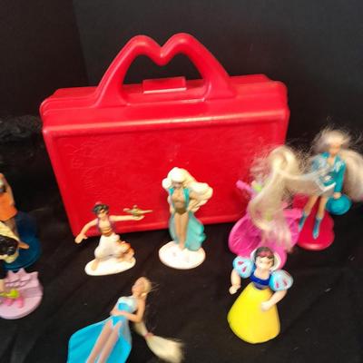 McDonald's Happy Meal toys, Barbie's and Disney characters with a red McDonald's box
