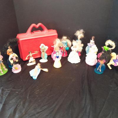 McDonald's Happy Meal toys, Barbie's and Disney characters with a red McDonald's box