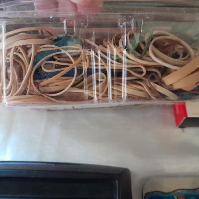 Assortment of office supplies, vintage typewriter items, power strip, office organization and more