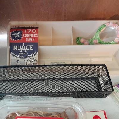 Assortment of office supplies, vintage typewriter items, power strip, office organization and more