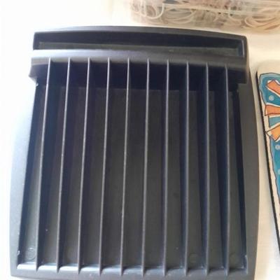 Assortment of office supplies, vintage typewriter items, power strip, office organization and more