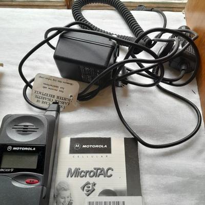 Two vintage Cell phones consumer cellular flip phone & Motorola MicroTAC with instructions & chargers