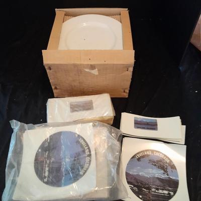 12 white salad plates with Loveland Colorado scenery transfers in boxes (2)