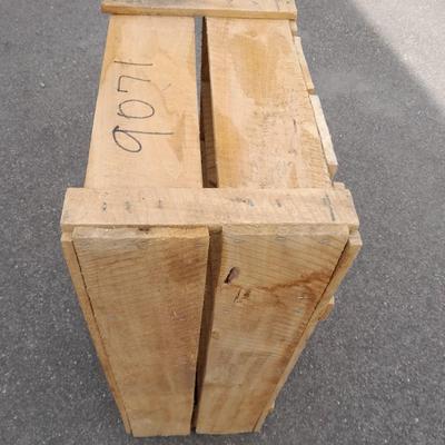 Wooden crate with Metal handled oval Ice tub, tall Fat tire beer bottles and Christmas brew 6 pack bottles.