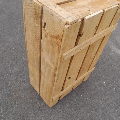 Wooden crate with Metal handled oval Ice tub, tall Fat tire beer bottles and Christmas brew 6 pack bottles.