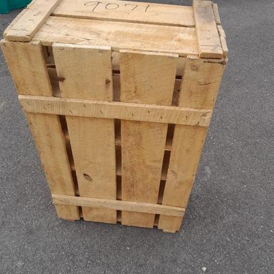 Wooden crate with Metal handled oval Ice tub, tall Fat tire beer bottles and Christmas brew 6 pack bottles.