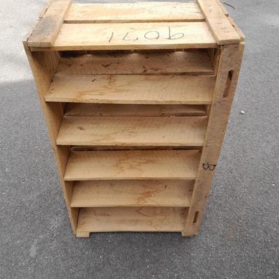 Wooden crate with Metal handled oval Ice tub, tall Fat tire beer bottles and Christmas brew 6 pack bottles.