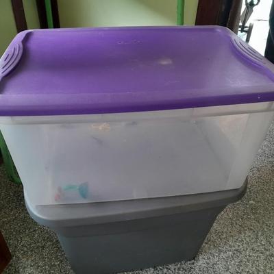 Four Plastic Storage totes of various sizes