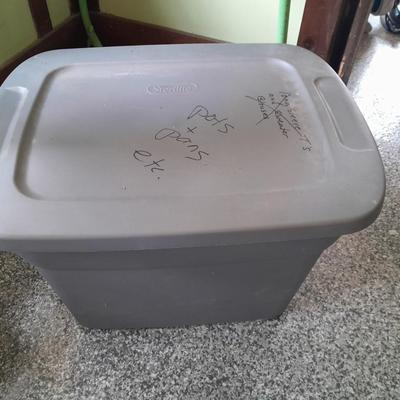 Four Plastic Storage totes of various sizes