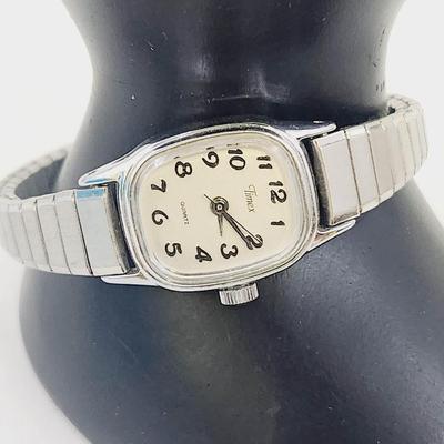TIMEX BA CELL STAINLESS STEEL WOMANS WRIST WATCH - STRETCH BAND - SILVER TONED
