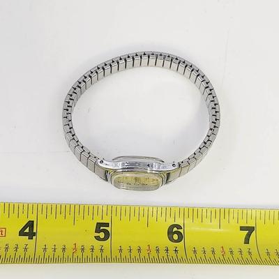 TIMEX BA CELL STAINLESS STEEL WOMANS WRIST WATCH - STRETCH BAND - SILVER TONED