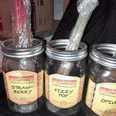 Wildberry incense stand with jars of different scented incense sticks