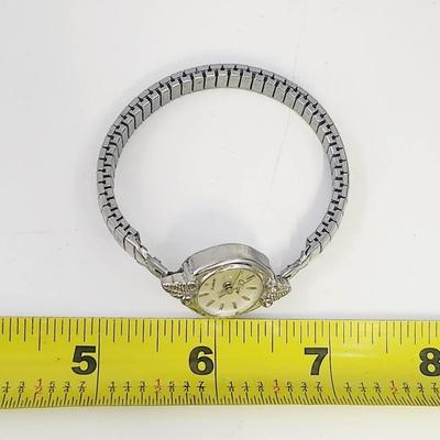 COLLEZIO QUARTZ DAINTY SILVER TONED WRIST WATCH - STRETCHY BAND